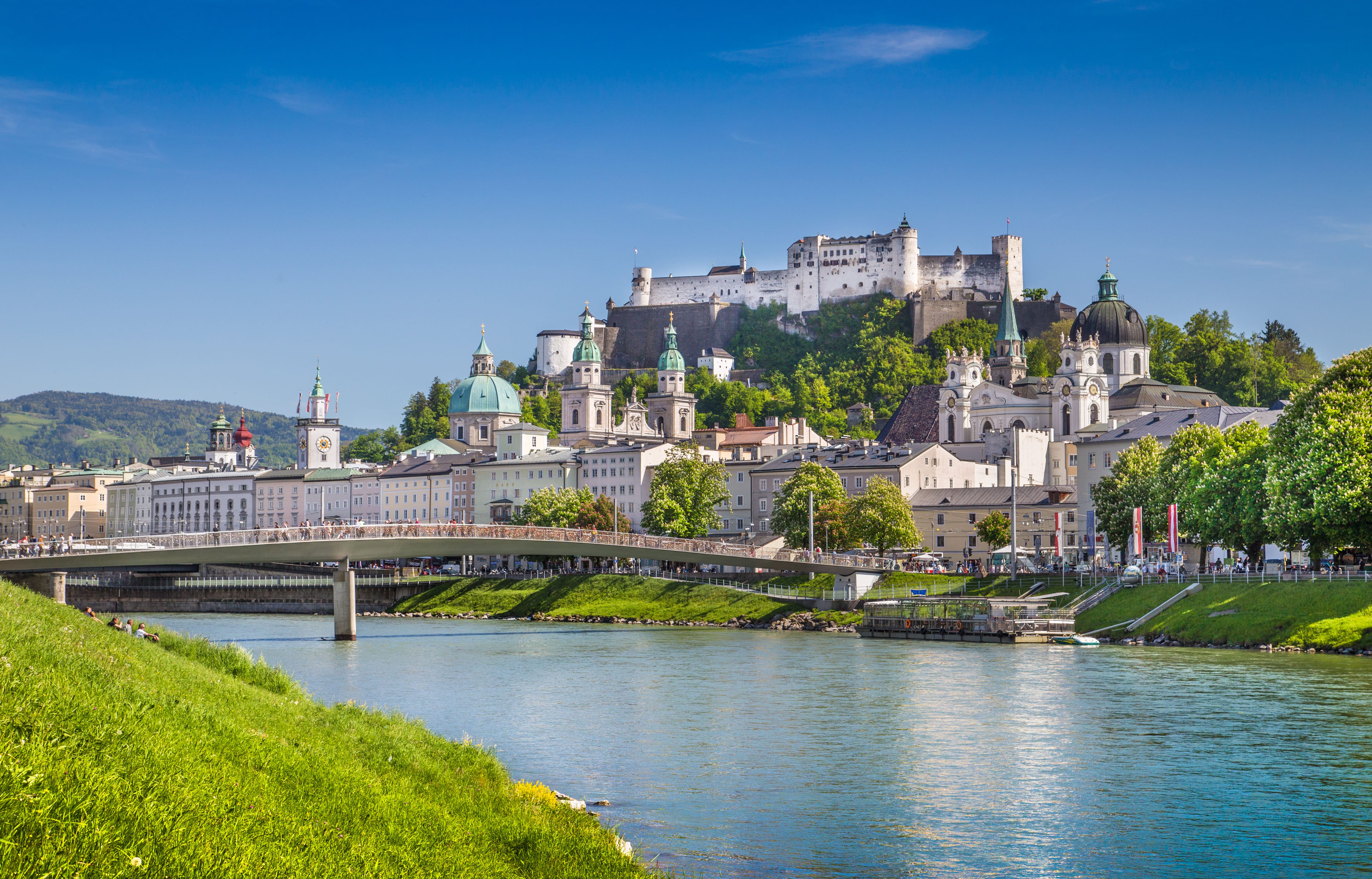 Salzburg skyline with Festung Hohensalzburg and Salzach river in summer ...